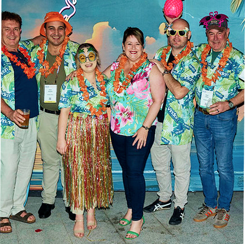 Group wearing matching custom shirts at a corporate team event