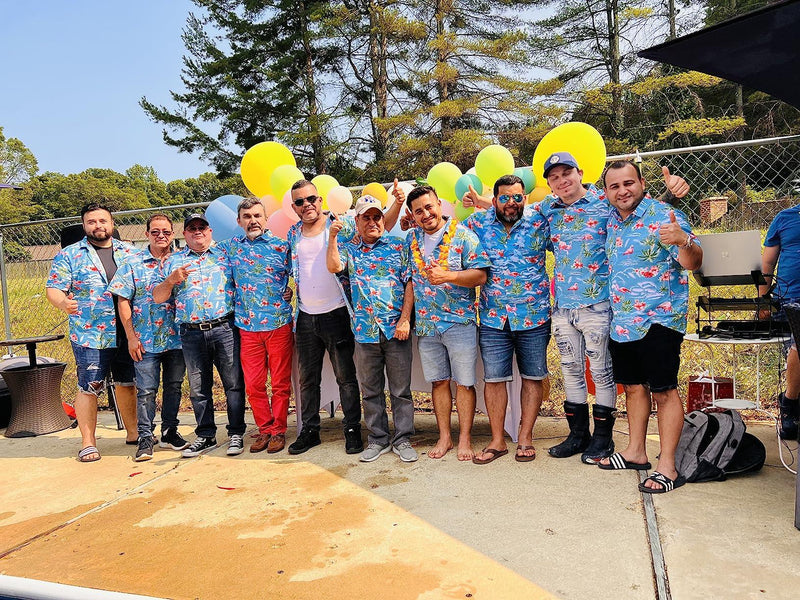 Group wearing matching custom shirts at a bucks party